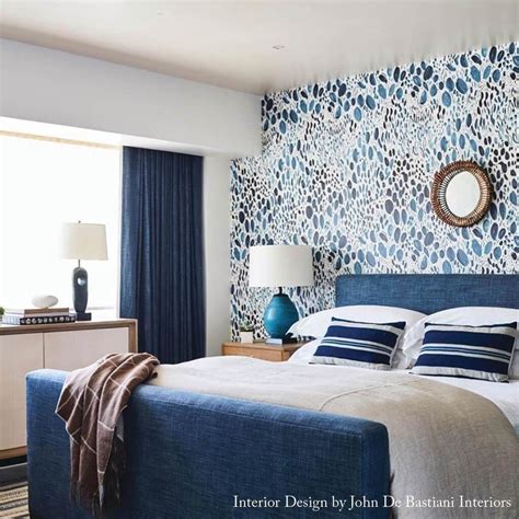 navy blue wallpapered master bedroom.